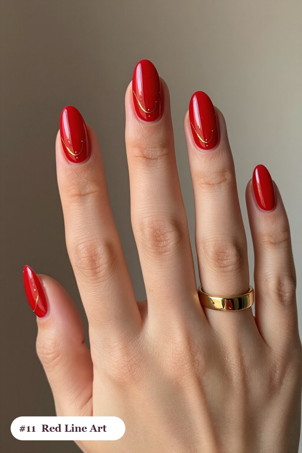 Medium almond red nails with fine gold line art and tiny dots drawn across every nail, with gold details - red nails almond
