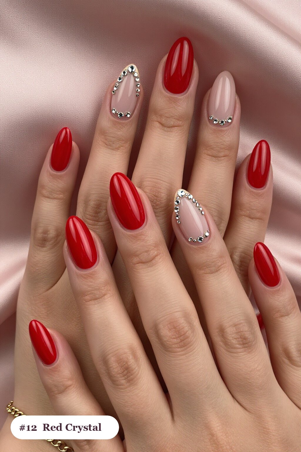 Medium almond red nails with rows of sparkling crystal rhinestones along the cuticle of every nail, with champagne details - red nails almond