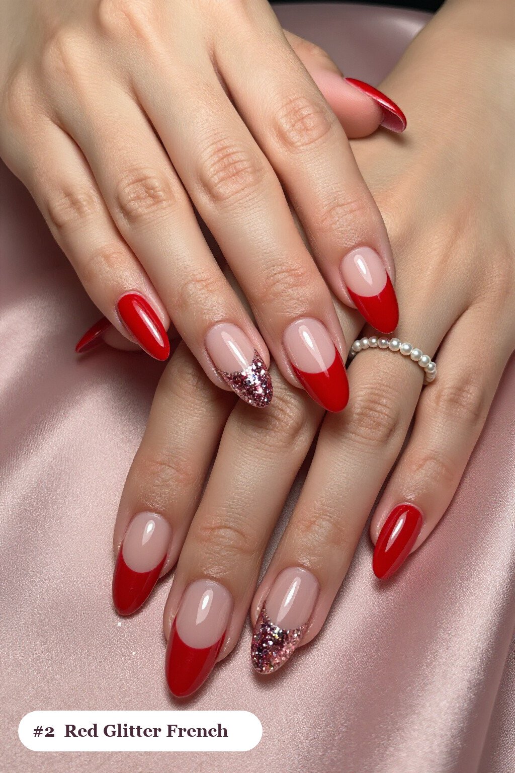 Medium almond red nails with glitter-packed french tips over a sheer nude base, with soft nude details - red nails almond