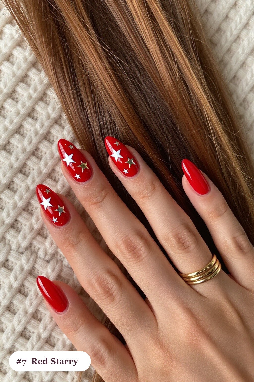 Medium almond red nails with white and gold stars and sparkles painted on every nail, with silver chrome details - red nails almond