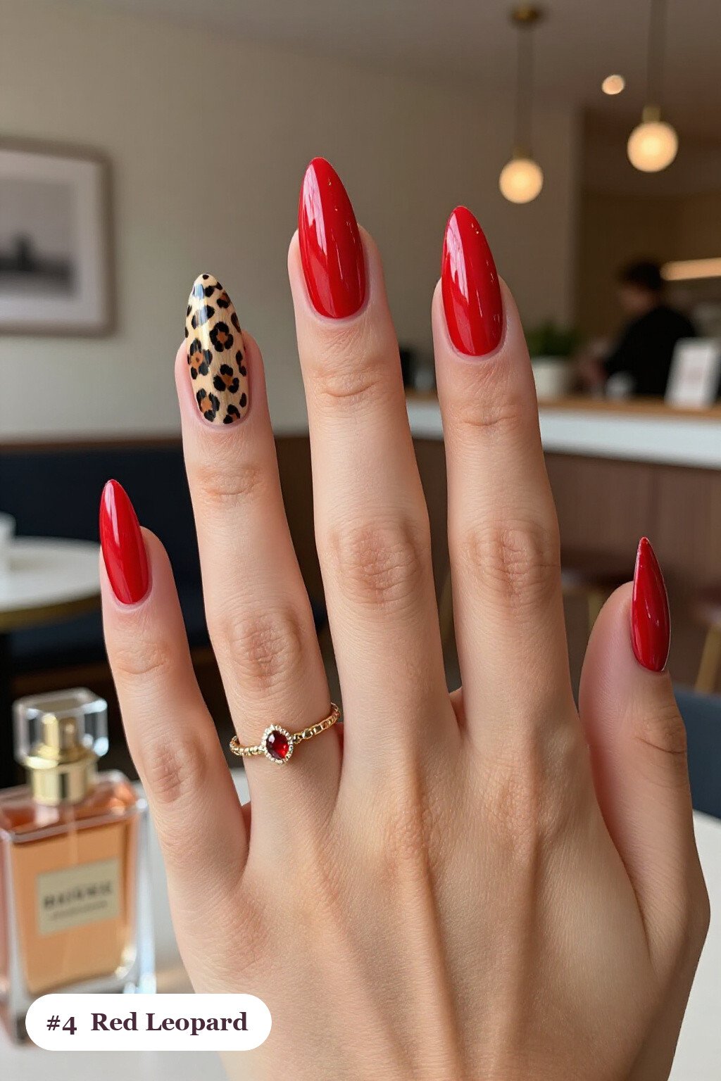 Stiletto Red Nails Featuring Leopard Print Accents and Champagne Sparkle - red nails design