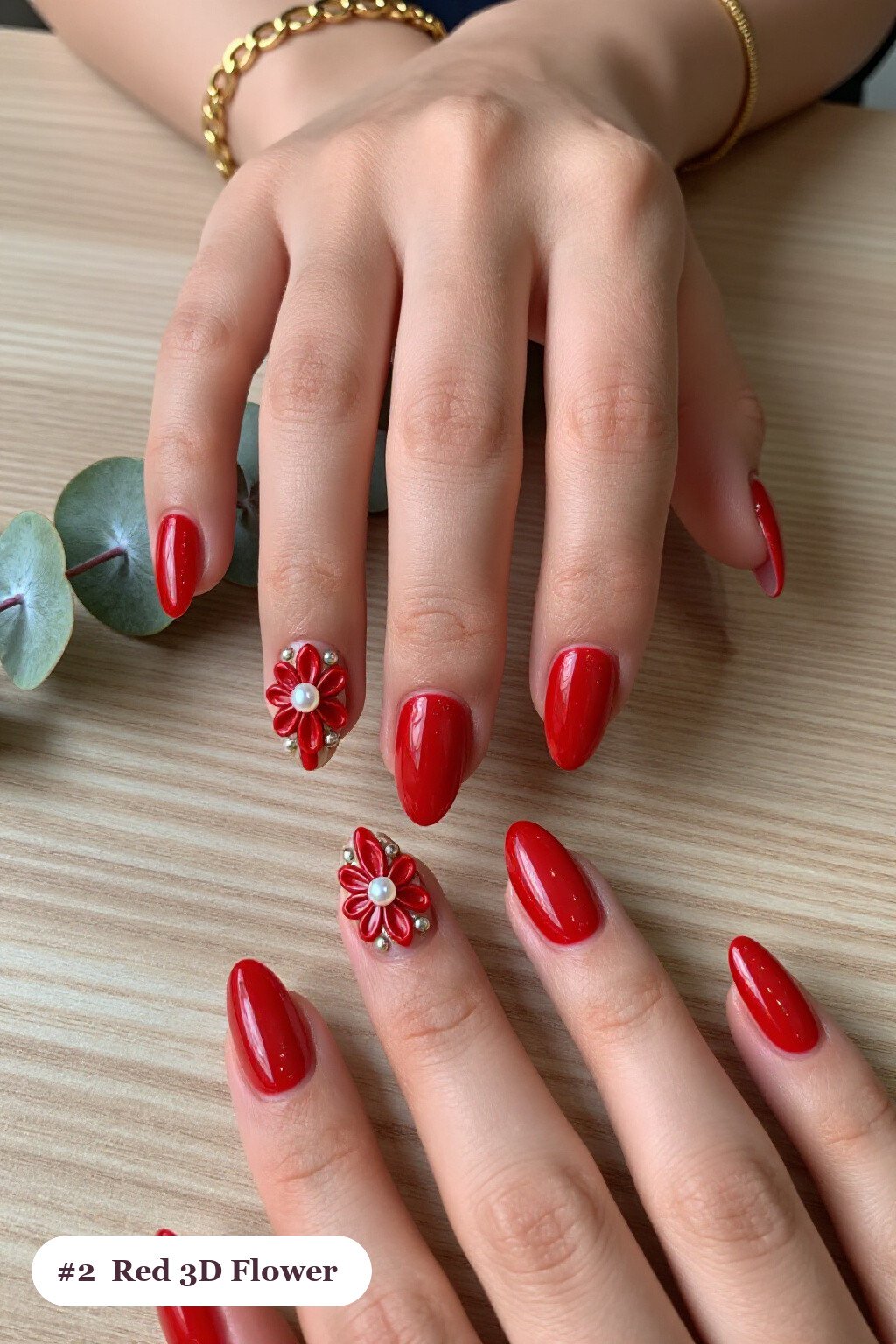 Almond‑Shaped Red Nails with 3D Pearl Flowers and Champagne Accents - red nails holiday Almond‑Shaped Red Nails with 3D Pearl Flowers and Champagne Accents - red nails holiday