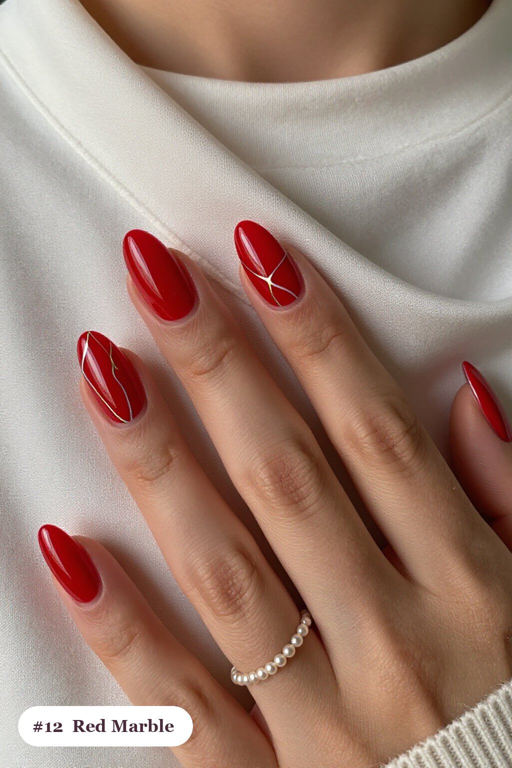 Bold Marble Veins in White and Gold Across Almond Red Nails with Silver Chrome Details - red nails short