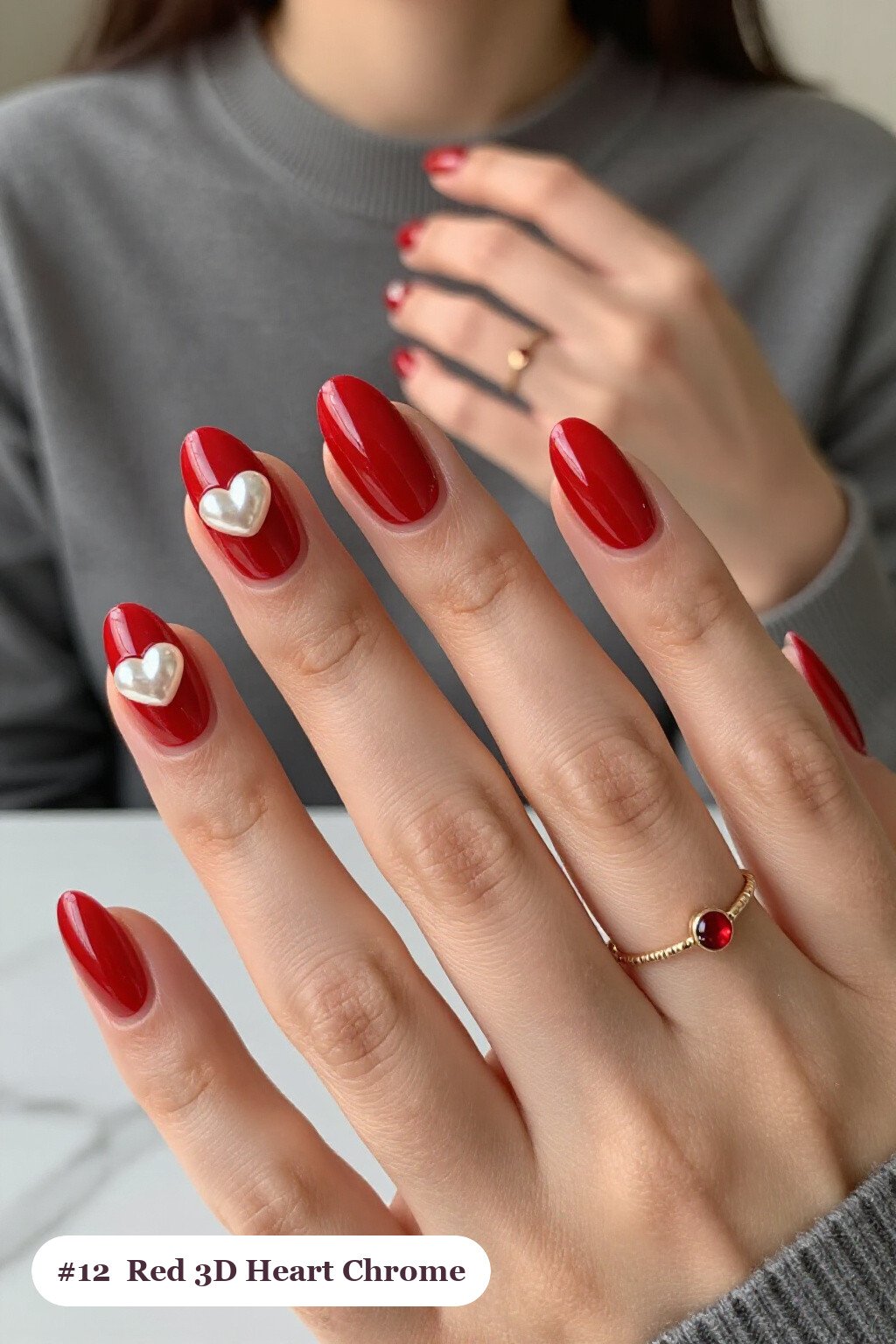 Medium oval red chrome nails with a liquid chrome mirror finish clearly visible on every nail, styled with chunky 3D gel hearts and pearls on three nails - red nails with chrome Medium oval red chrome nails with a liquid chrome mirror finish clearly visible on every nail, styled with chunky 3D gel hearts and pearls on three nails - red nails with chrome