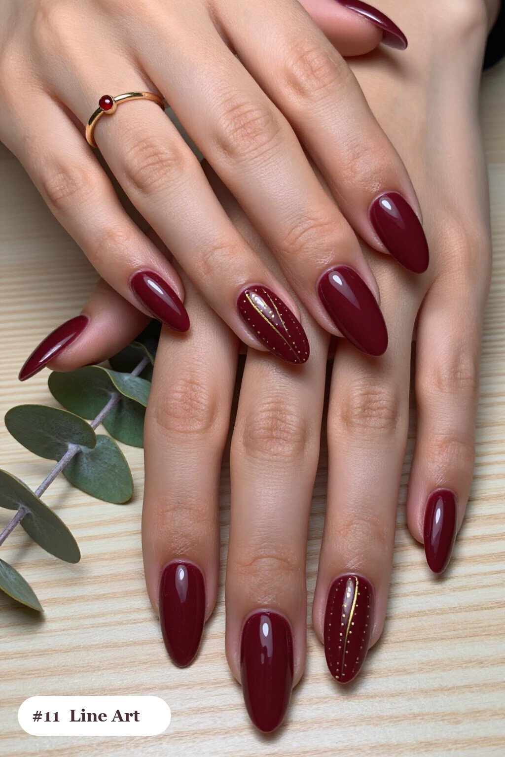 Burgundy Gold‑Line Almond Nails - september fall nails