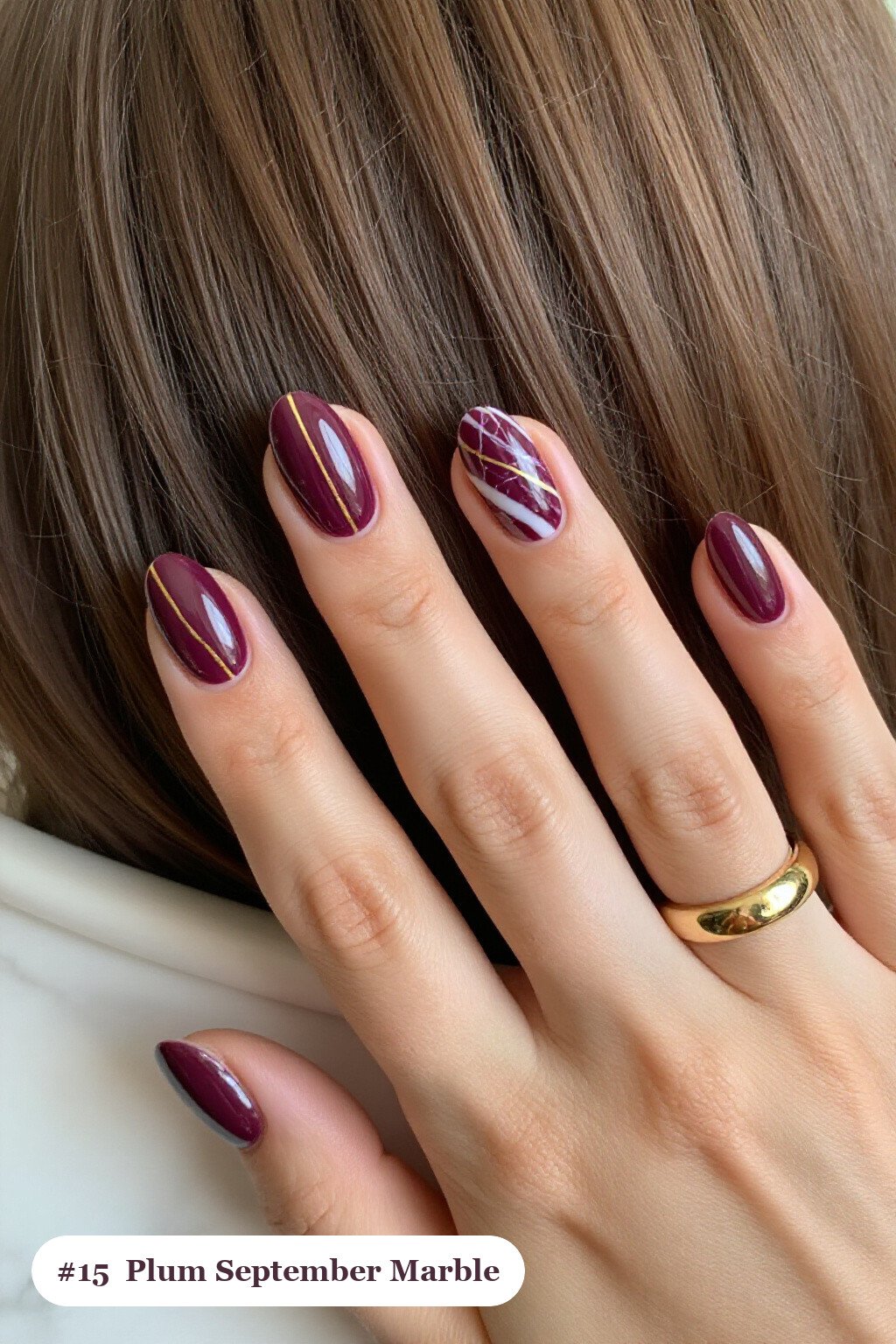 Deep Plum Marble‑Vein Oval Nails - september fall nails