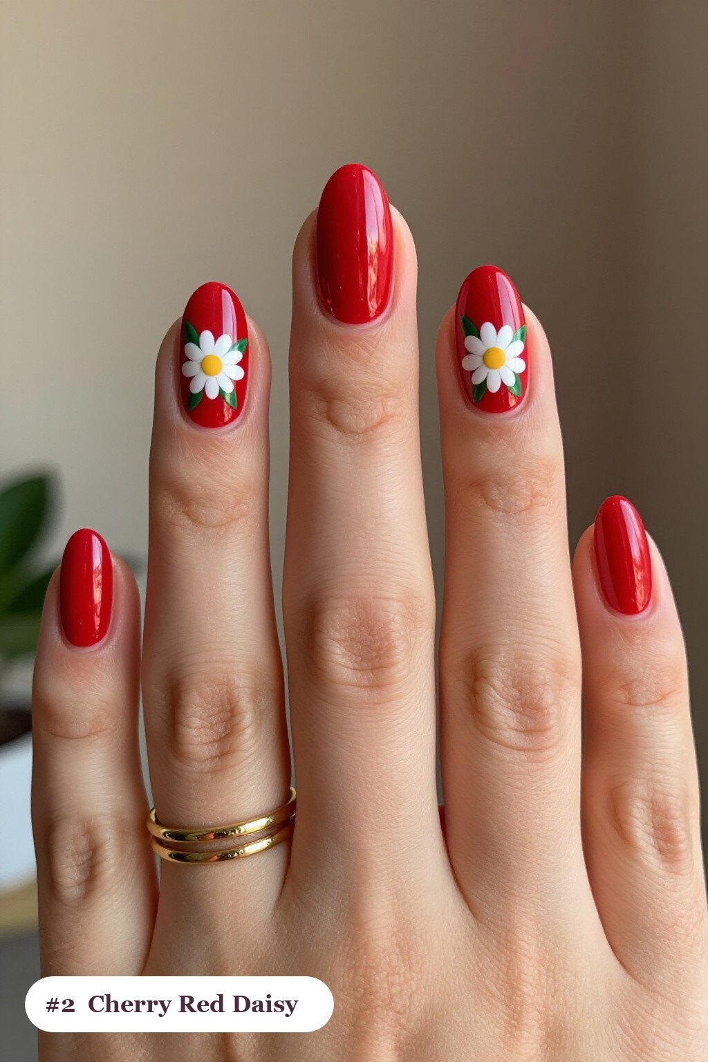 Cherry Red Short Almond Nails Covered in Hand‑Painted Daisies & Green Leaves - short almond nails designs