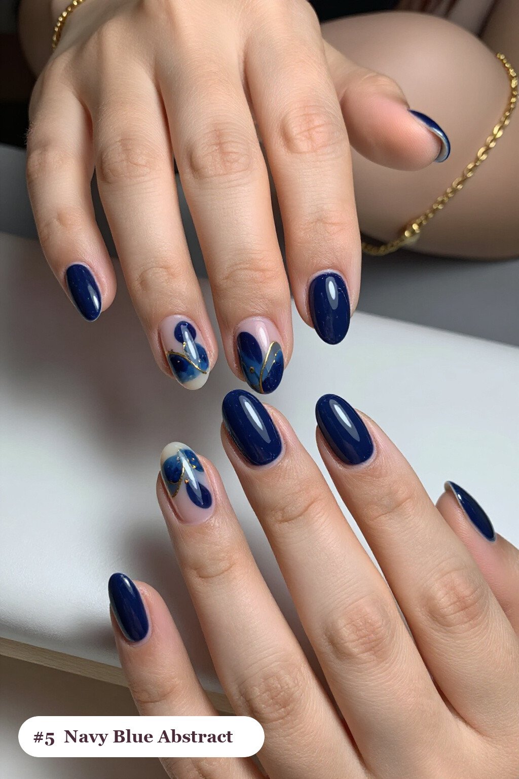 Navy Blue Short Almond Nails Showcasing Abstract Color Blobs, Gold Outlines & Dots - short almond nails designs