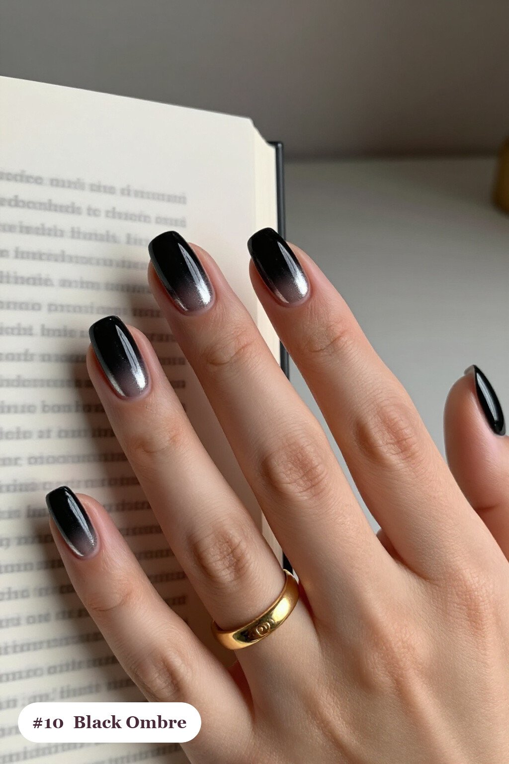 Short almond black nails with a vivid two-colour ombre melting from the cuticle to the tips, with silver chrome details, perfect for halloween - short halloween nails black Short almond black nails with a vivid two-colour ombre melting from the cuticle to the tips, with silver chrome details, perfect for halloween - short halloween nails black