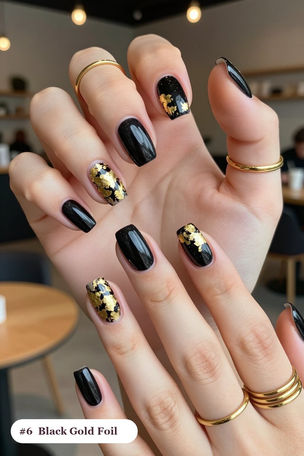 Short almond black nails with dense gold foil flakes and gold leaf scattered across every nail, with gold details, perfect for halloween - short halloween nails black Short almond black nails with dense gold foil flakes and gold leaf scattered across every nail, with gold details, perfect for halloween - short halloween nails black