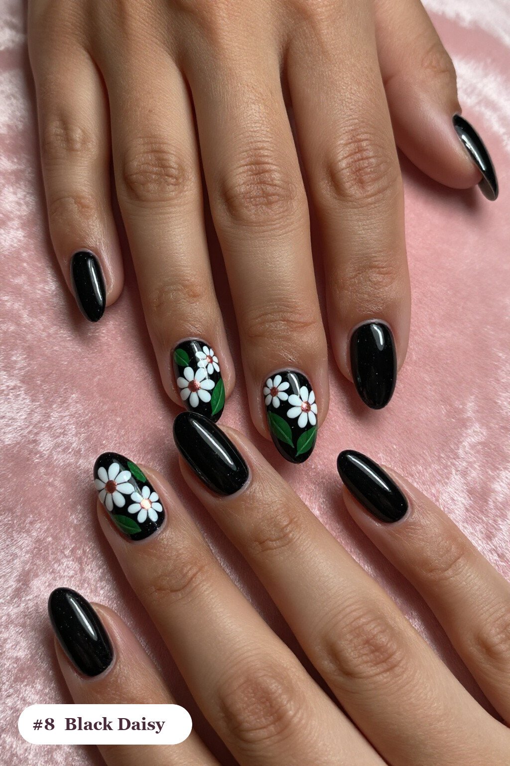 Short almond black nails with hand-painted daisies and green leaves across every nail, with rose gold details, perfect for halloween - short halloween nails black Short almond black nails with hand-painted daisies and green leaves across every nail, with rose gold details, perfect for halloween - short halloween nails black