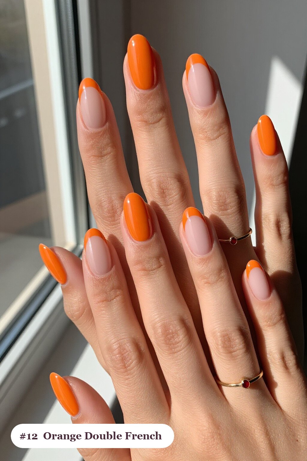 Short almond orange nails with double-line french tips in two colours, perfect for halloween - short simple halloween nail ideas Short almond orange nails with double-line french tips in two colours, perfect for halloween - short simple halloween nail ideas