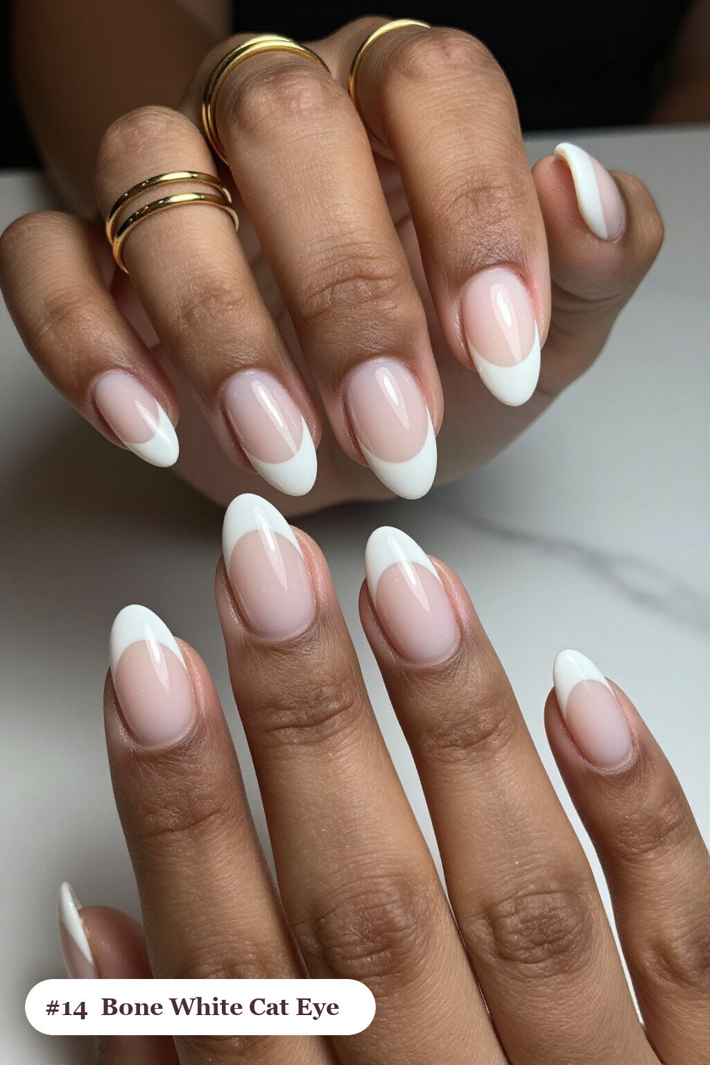 Short almond bone white nails with a glowing shimmer band of light running down the centre of each nail like a gemstone, perfect for halloween - short simple halloween nail ideas Short almond bone white nails with a glowing shimmer band of light running down the centre of each nail like a gemstone, perfect for halloween - short simple halloween nail ideas