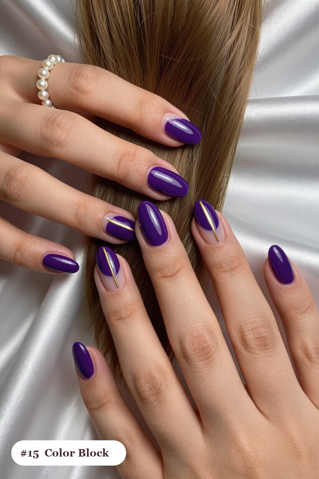 Short almond deep purple nails in a colour-block design split diagonally with a thin gold line, perfect for halloween - short simple halloween nail ideas Short almond deep purple nails in a colour-block design split diagonally with a thin gold line, perfect for halloween - short simple halloween nail ideas