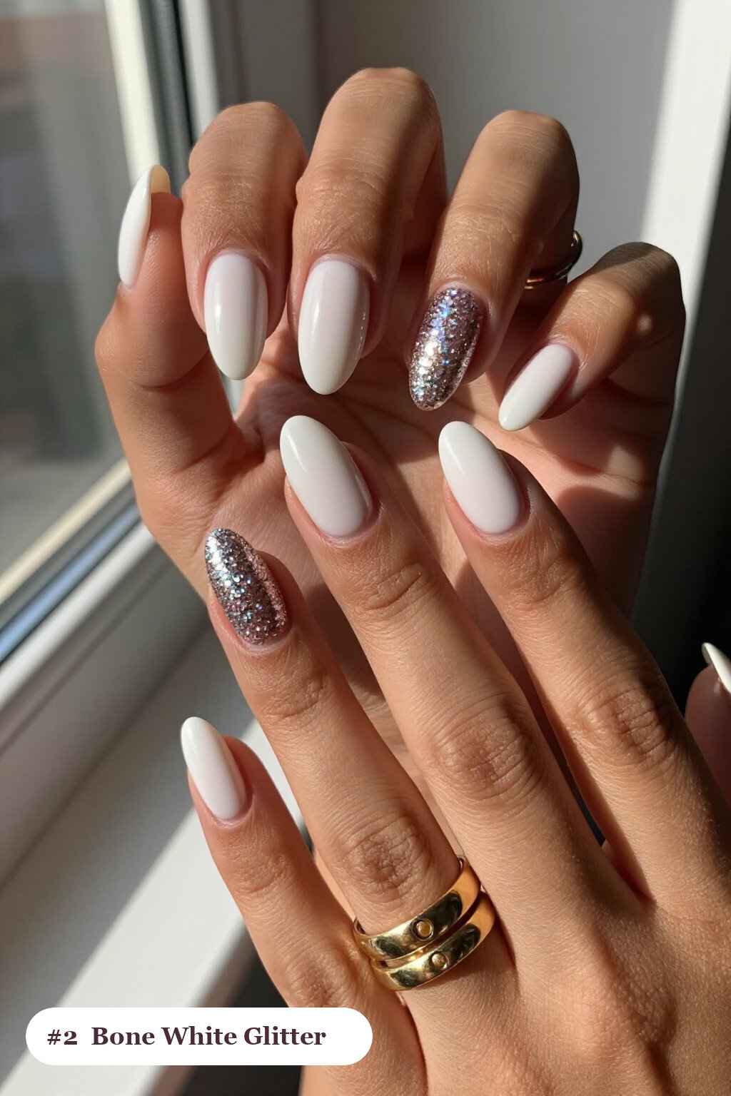 Short almond bone white nails with a sparkling glitter gradient rising from the cuticle, perfect for halloween - short simple halloween nail ideas Short almond bone white nails with a sparkling glitter gradient rising from the cuticle, perfect for halloween - short simple halloween nail ideas