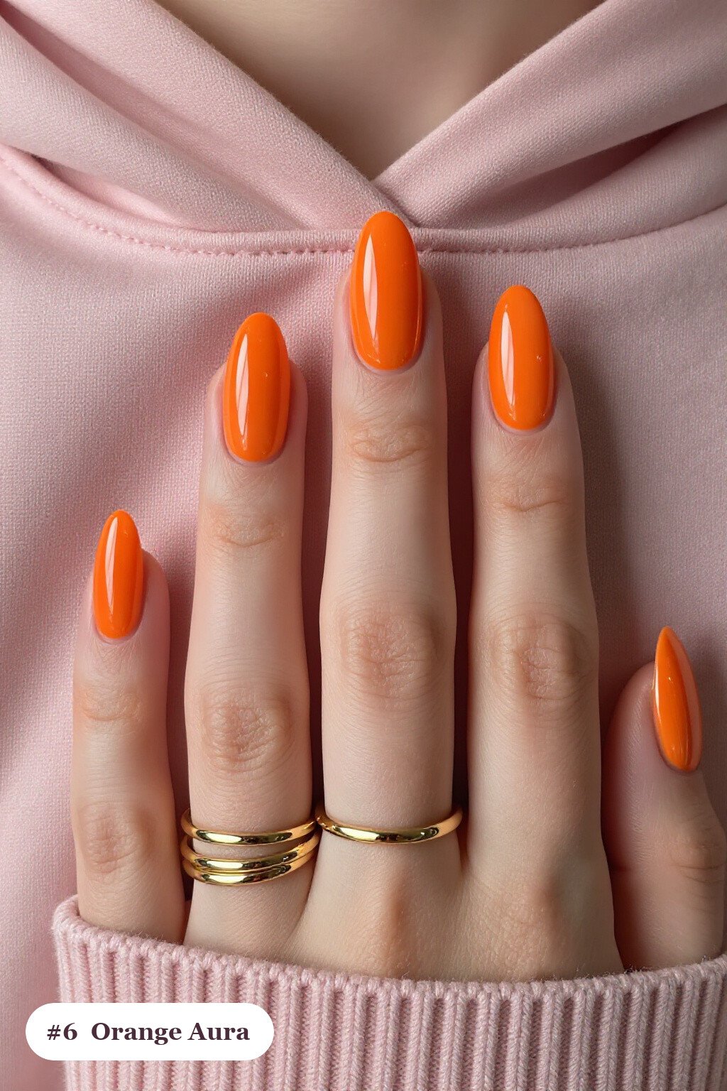 Short almond orange nails with a glowing airbrushed aura in the centre of each nail, perfect for halloween - short simple halloween nail ideas Short almond orange nails with a glowing airbrushed aura in the centre of each nail, perfect for halloween - short simple halloween nail ideas