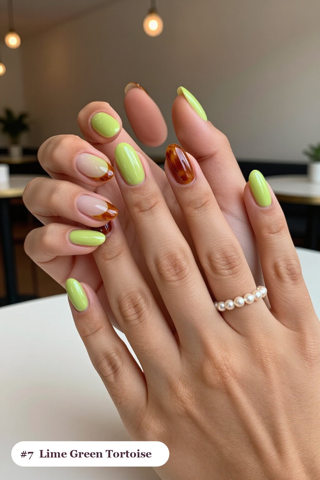 Short almond lime green nails with glossy amber tortoiseshell on two accent nails, perfect for halloween - short simple halloween nail ideas Short almond lime green nails with glossy amber tortoiseshell on two accent nails, perfect for halloween - short simple halloween nail ideas