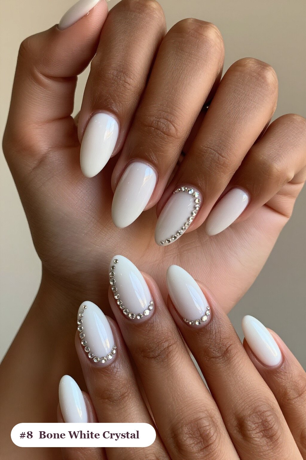 Short almond bone white nails with rows of sparkling crystal rhinestones along the cuticle of every nail, perfect for halloween - short simple halloween nail ideas Short almond bone white nails with rows of sparkling crystal rhinestones along the cuticle of every nail, perfect for halloween - short simple halloween nail ideas
