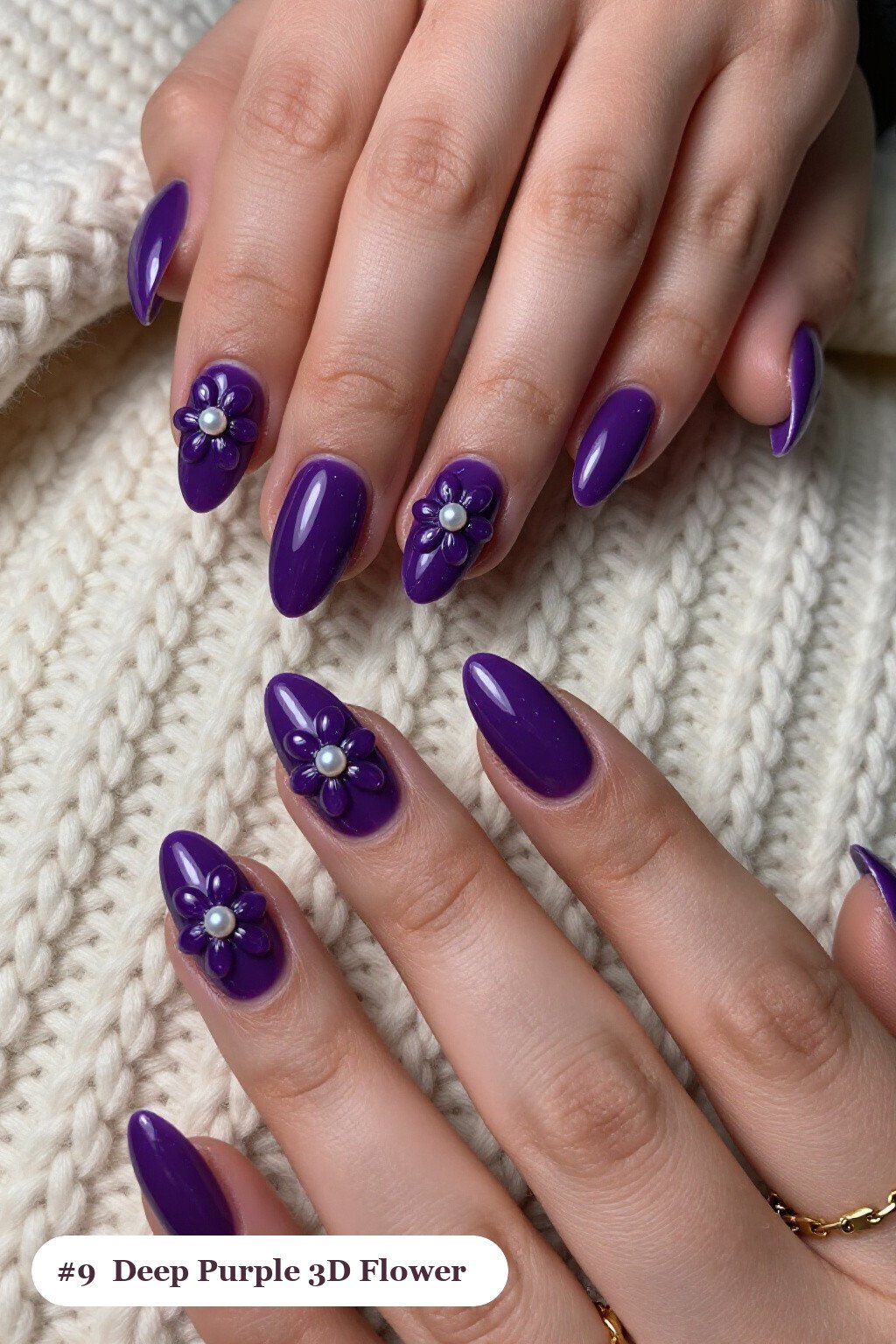 Short almond deep purple nails with raised 3D flowers with pearl centres on two accent nails, perfect for halloween - short simple halloween nail ideas Short almond deep purple nails with raised 3D flowers with pearl centres on two accent nails, perfect for halloween - short simple halloween nail ideas
