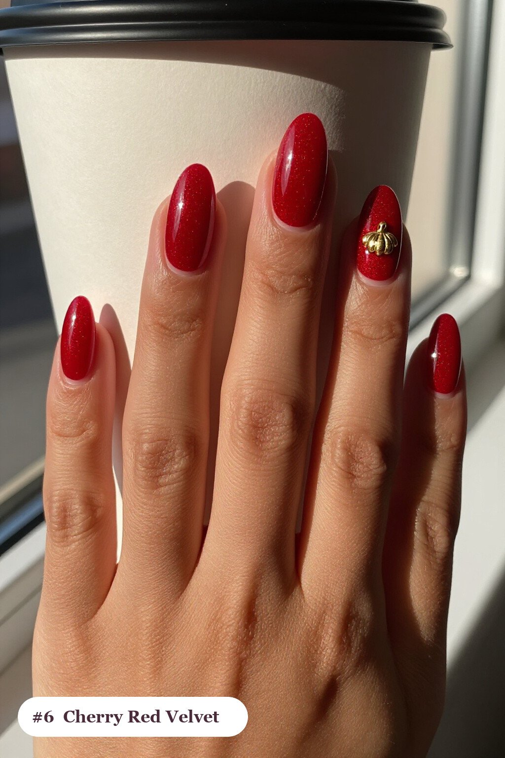 Cherry Red Velvet‑Shimmer Almond Nails with a Gold Charm Accent - short thanksgiving nails Cherry Red Velvet‑Shimmer Almond Nails with a Gold Charm Accent - short thanksgiving nails