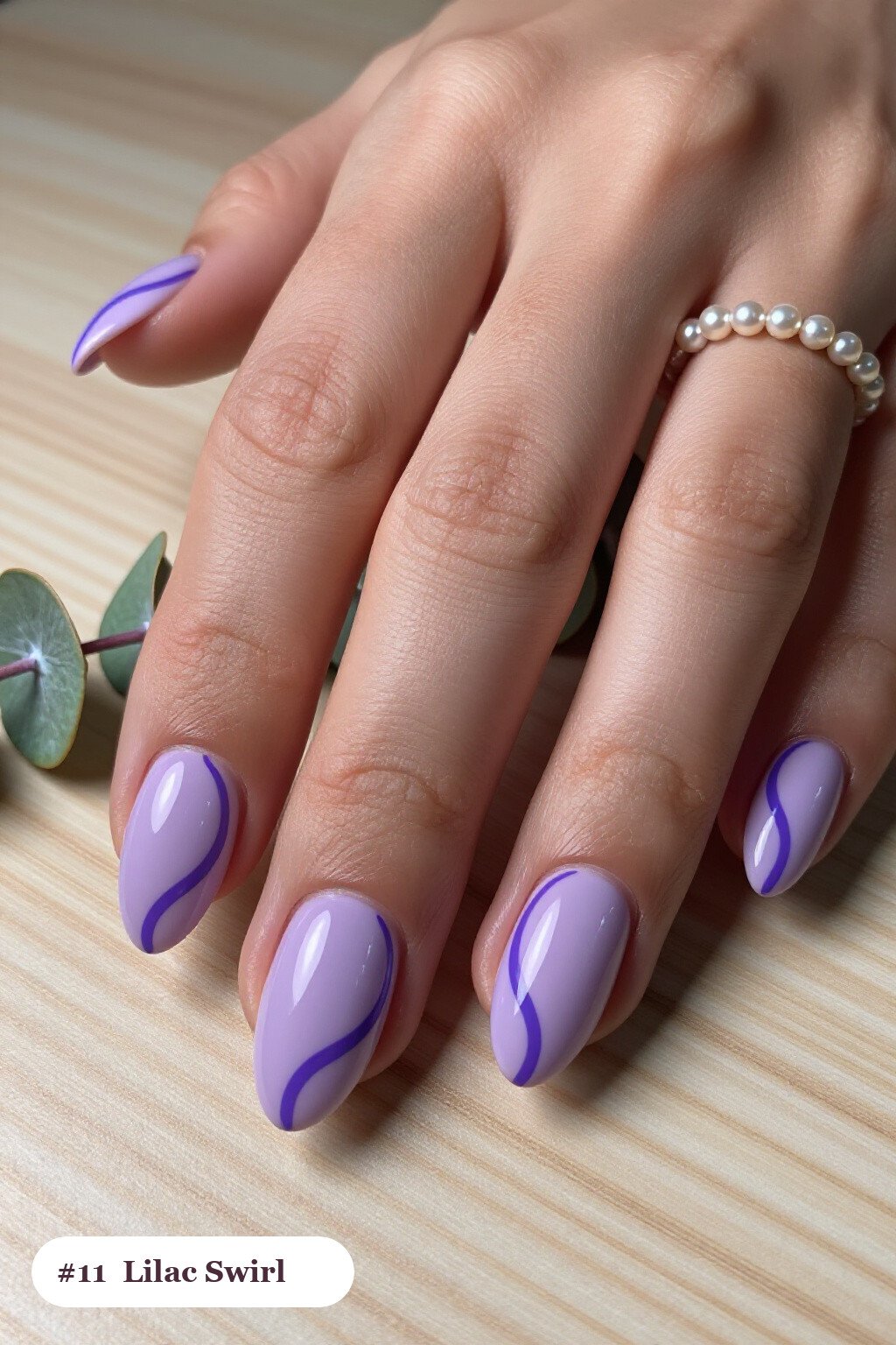 Lilac Almond Nails Featuring Contrasting Hand‑Painted Swirl Lines - simple almond nails