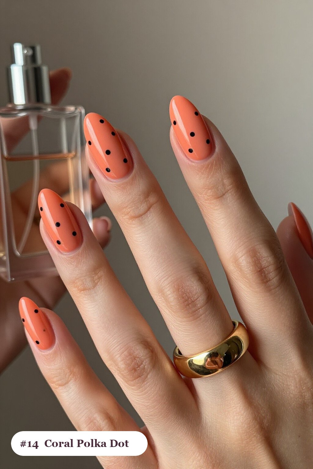 Coral Almond Nails with Playful Dual‑Tone Polka Dots on Alternating Digits - simple almond nails