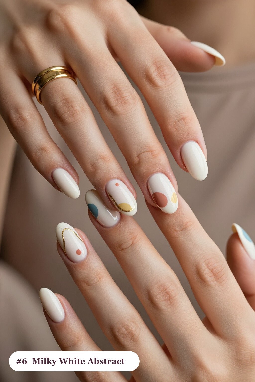Milky White Almond Nails Showcasing Abstract Colour Blobs and Gold Outlines - simple almond nails