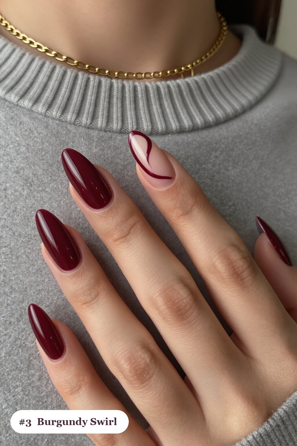 Long almond burgundy nails with bold hand-painted swirl lines flowing across every nail in a contrasting colour, perfect for christmas - simple christmas nails Long almond burgundy nails with bold hand-painted swirl lines flowing across every nail in a contrasting colour, perfect for christmas - simple christmas nails