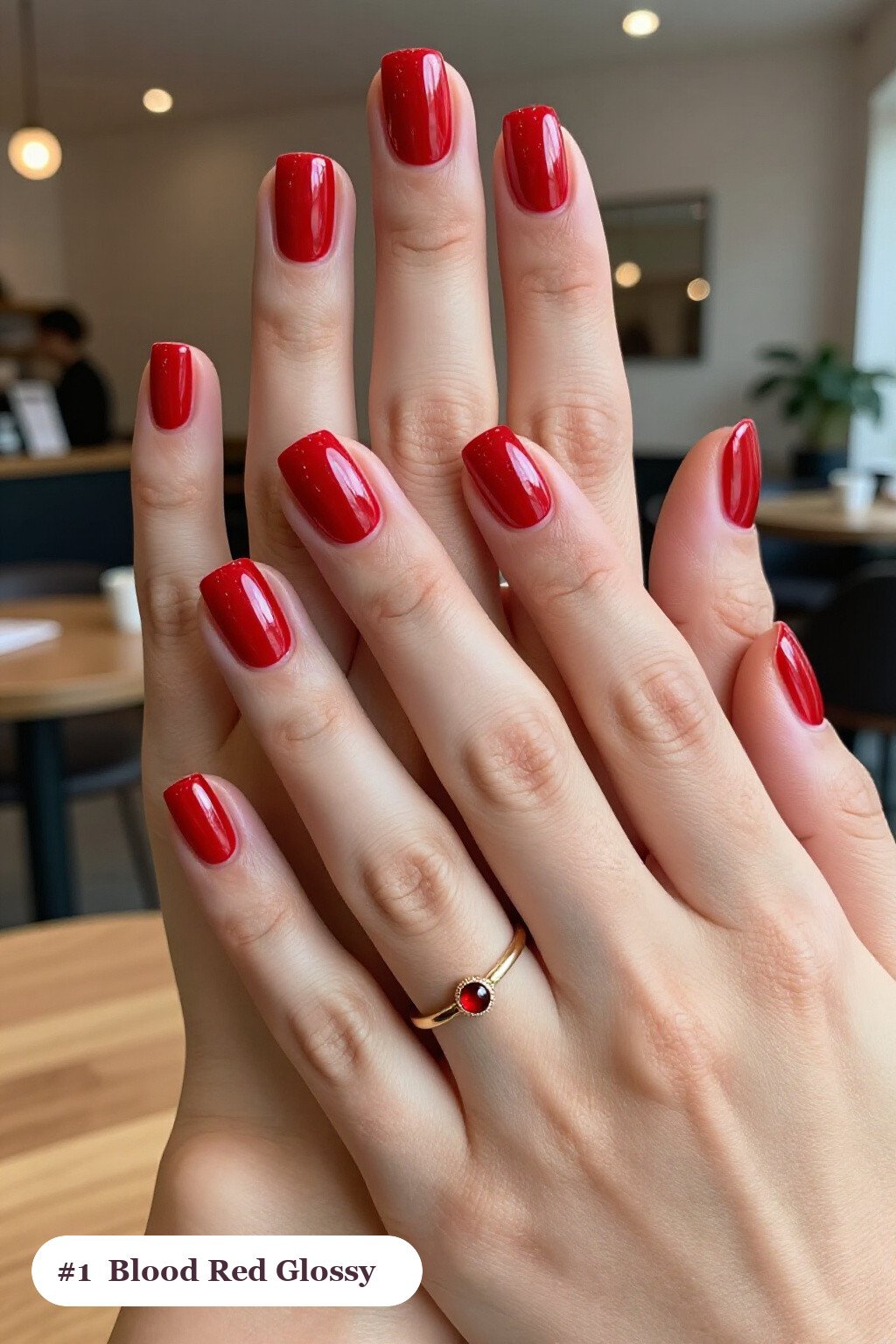 Short square blood red nails in a flawless mirror-glossy full-colour finish, perfect for halloween - simple halloween nail designs