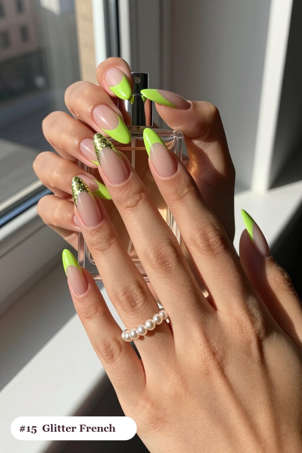 Long almond lime green nails with glitter-packed french tips over a sheer nude base, perfect for halloween - simple halloween nail designs