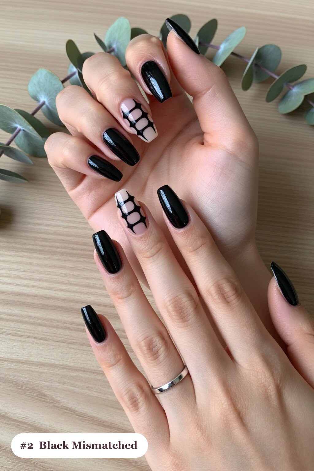 Long coffin black nails as a mismatched set where every nail has a different pattern in the same colour story, perfect for halloween - simple halloween nail designs