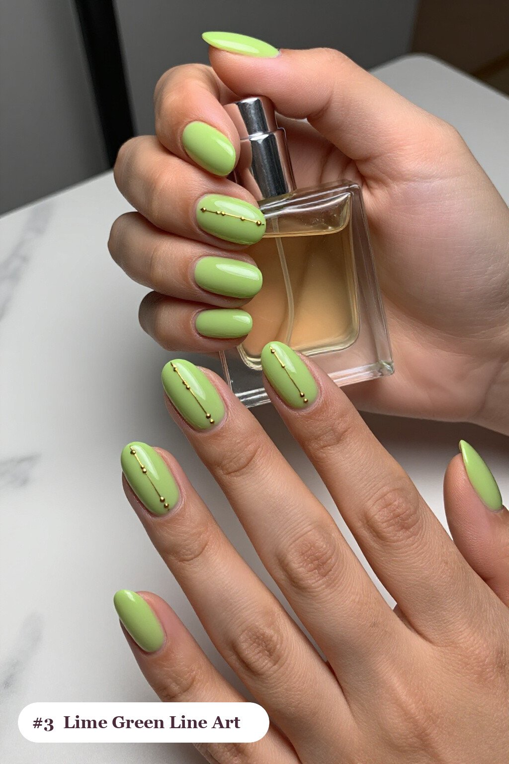Medium oval lime green nails with fine gold line art and tiny dots drawn across every nail, perfect for halloween - simple halloween nail designs