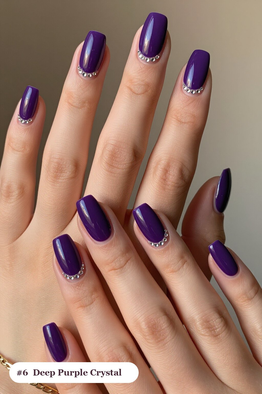Medium square deep purple nails with rows of sparkling crystal rhinestones along the cuticle of every nail, perfect for halloween - simple halloween nail designs