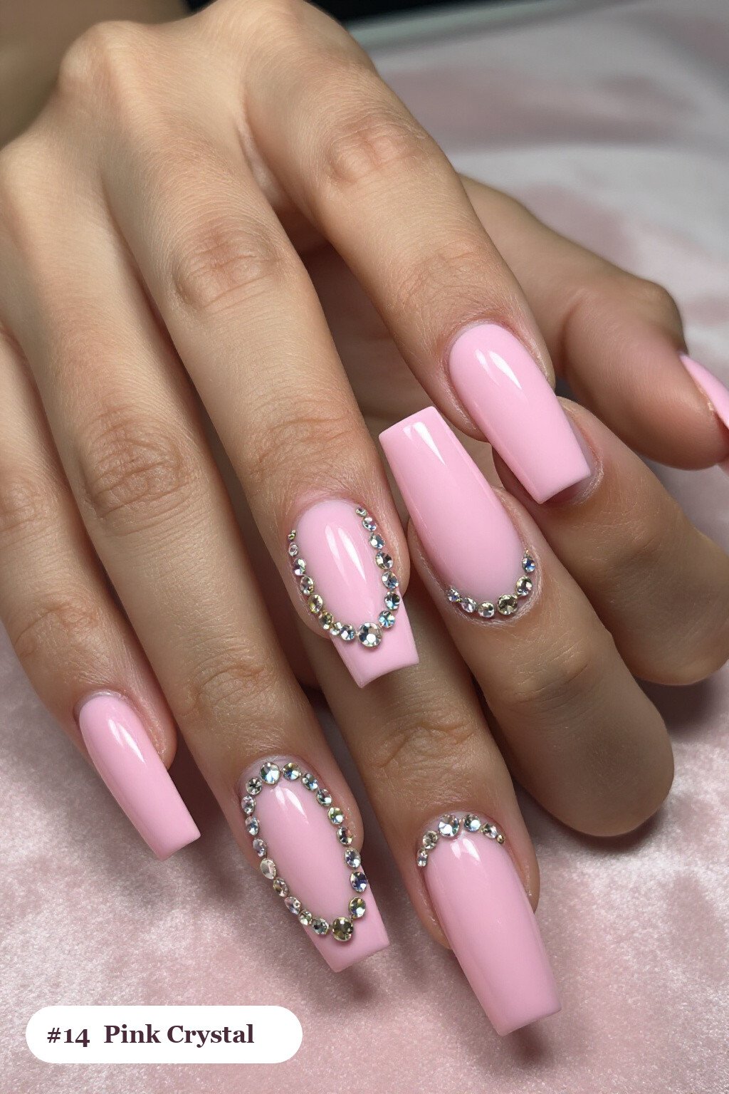 Long square pink nails with rows of sparkling crystal rhinestones along the cuticle of every nail, with champagne details - simple pink nails