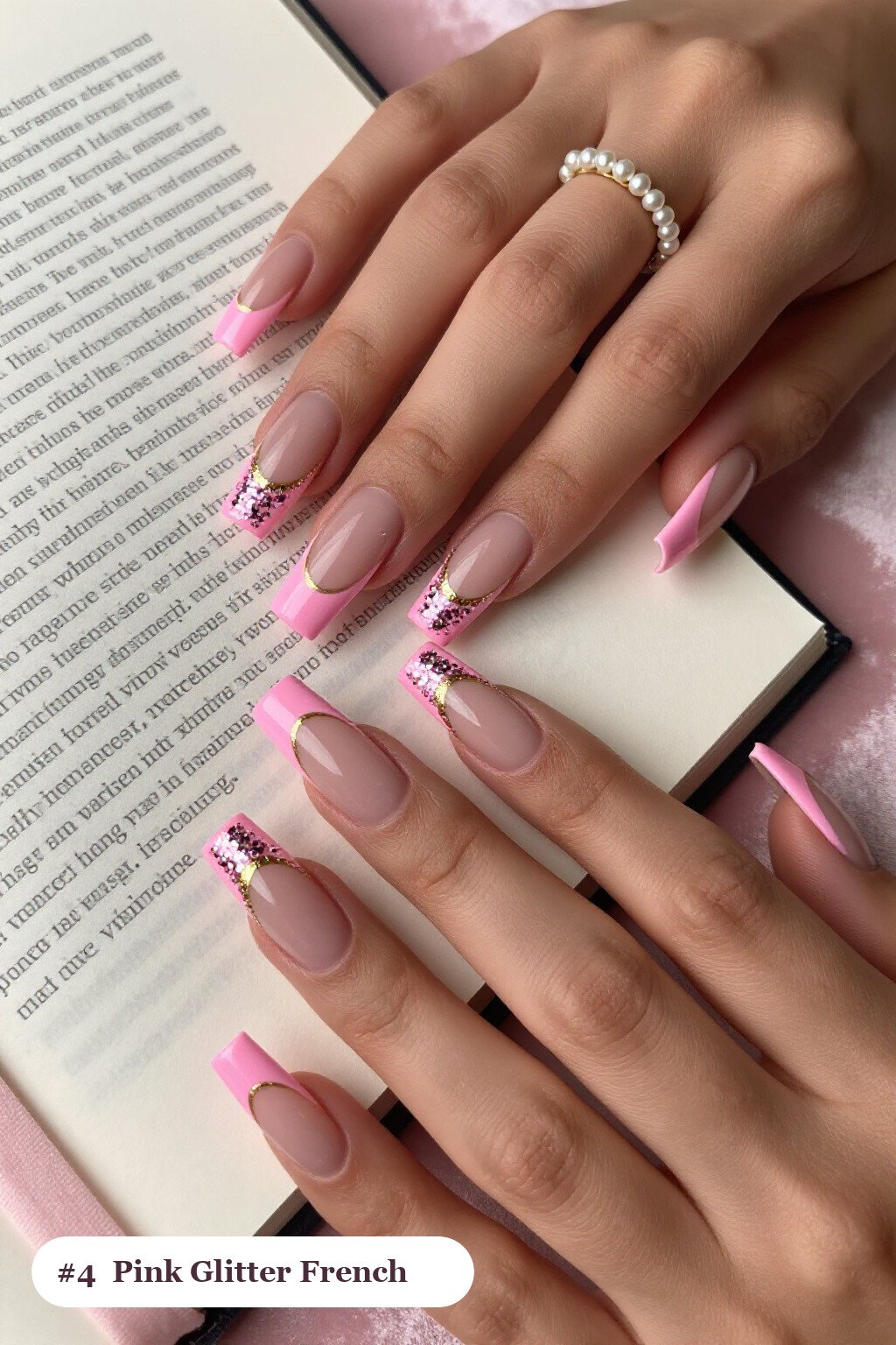 Long square pink nails with glitter-packed french tips over a sheer nude base, with gold details - simple pink nails