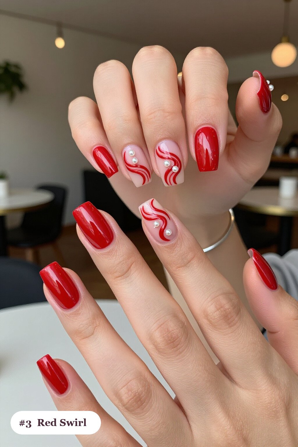 Square Red Nails Featuring Bold Hand‑Painted Swirl Lines and Pearls - simple red nails