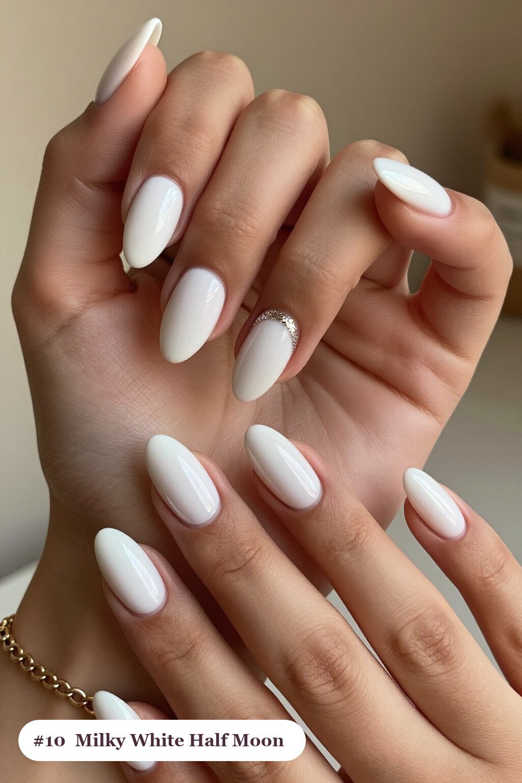 Short almond milky white nails in a half-moon design with a glitter crescent at the cuticle, thanksgiving style - simple short thanksgiving nail designs
