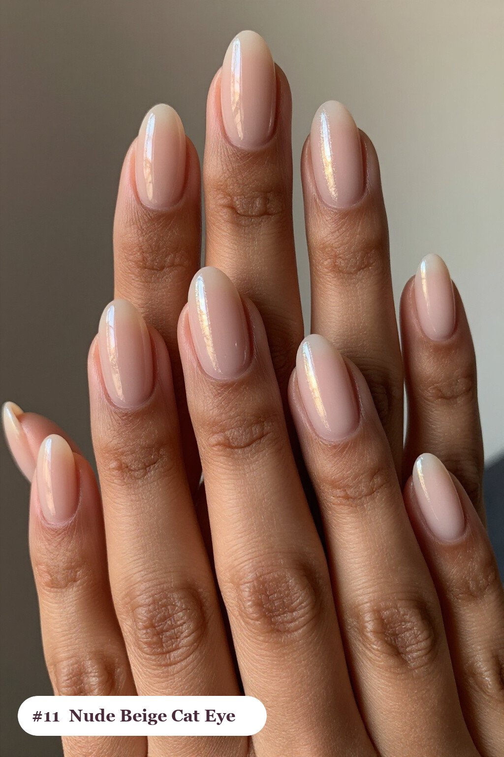 Short almond nude beige nails with a glowing shimmer band of light running down the centre of each nail like a gemstone, thanksgiving style - simple short thanksgiving nail designs