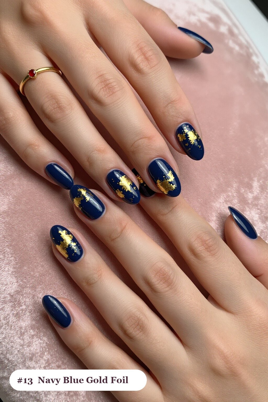 Short almond navy blue nails with dense gold foil flakes and gold leaf scattered across every nail, thanksgiving style - simple short thanksgiving nail designs