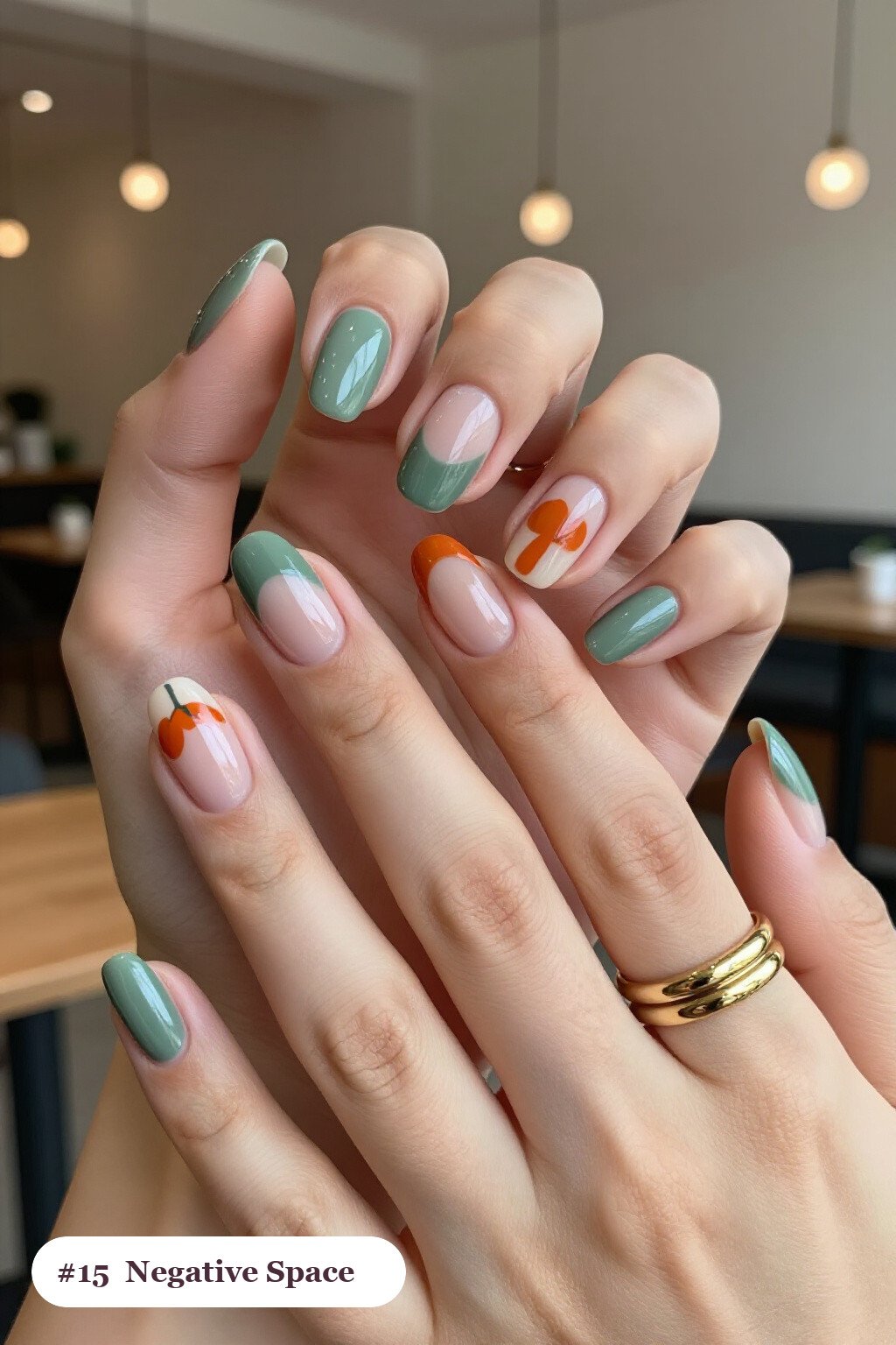 Short almond sage green nails in a negative-space design with sheer nude windows and bold colour shapes, thanksgiving style - simple short thanksgiving nail designs