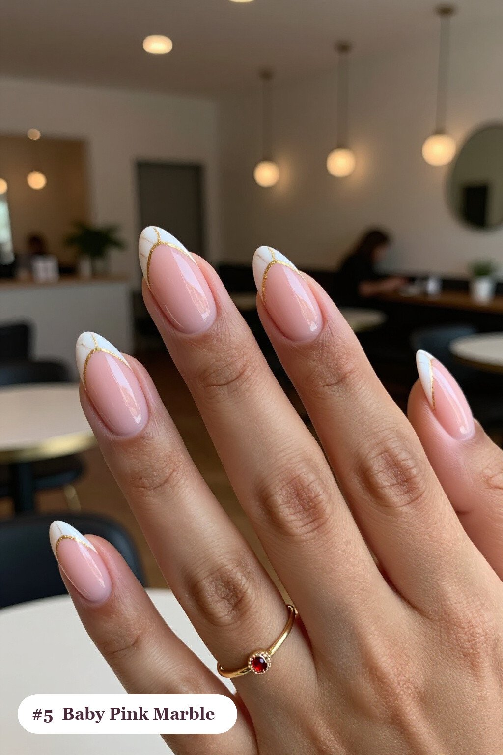 Short almond baby pink nails with bold marble veins in white and gold across every nail, thanksgiving style - simple short thanksgiving nail designs