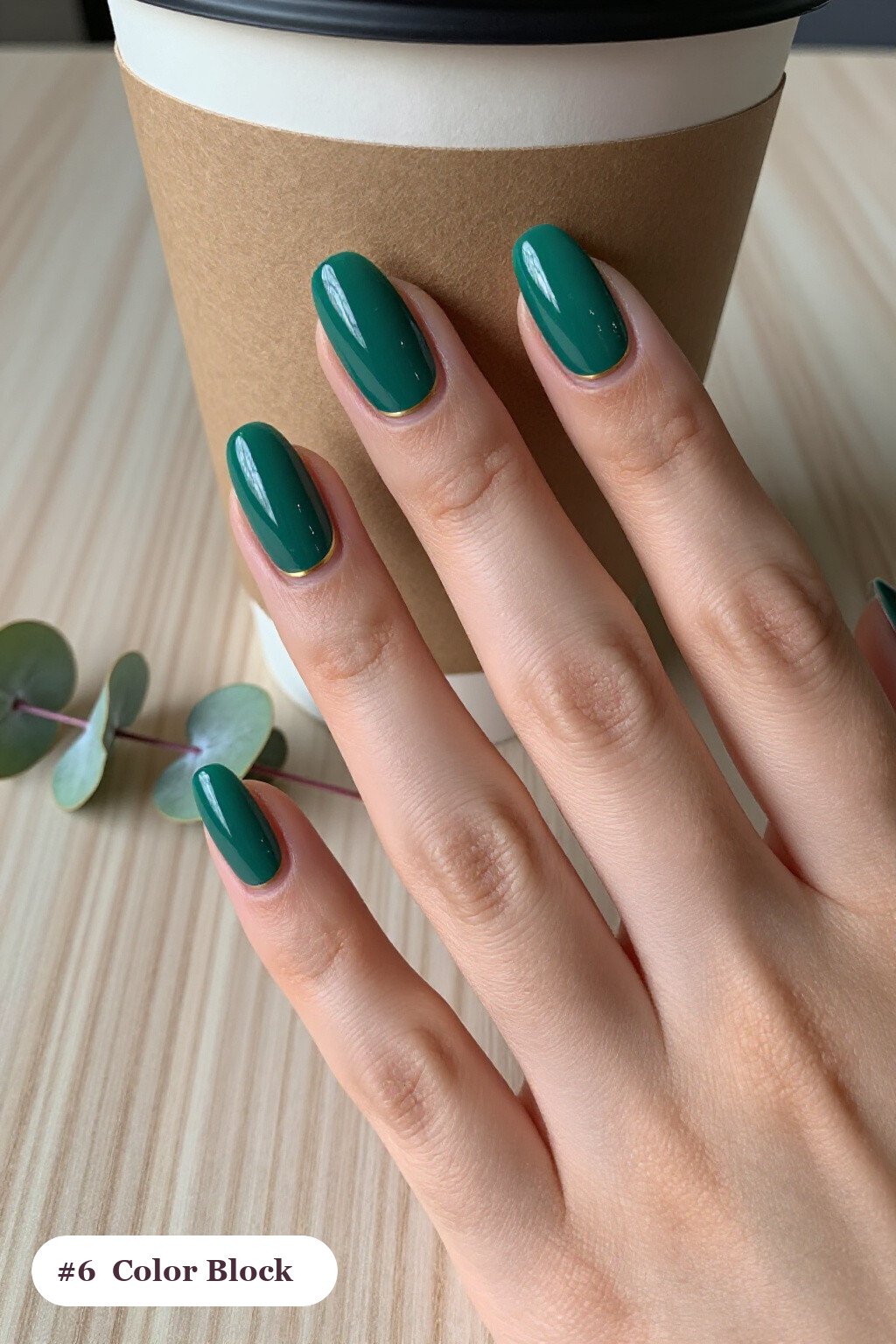 Short almond emerald green nails in a colour-block design split diagonally with a thin gold line, thanksgiving style - simple short thanksgiving nail designs