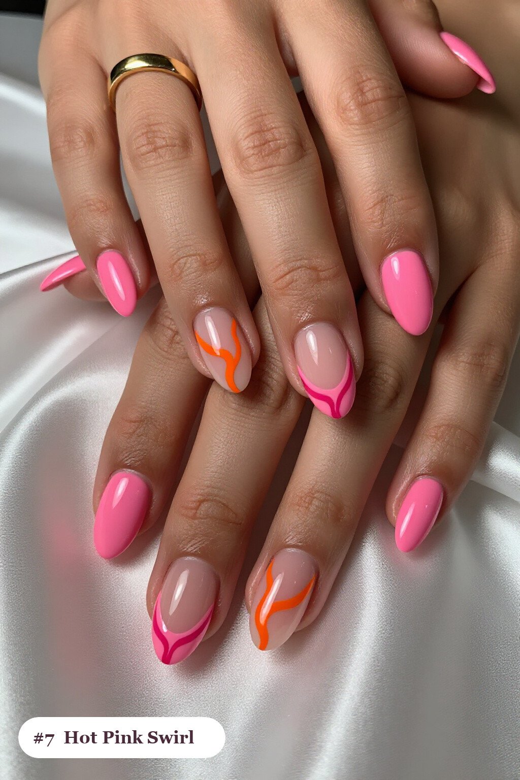 Short almond hot pink nails with bold hand-painted swirl lines flowing across every nail in a contrasting colour, thanksgiving style - simple short thanksgiving nail designs