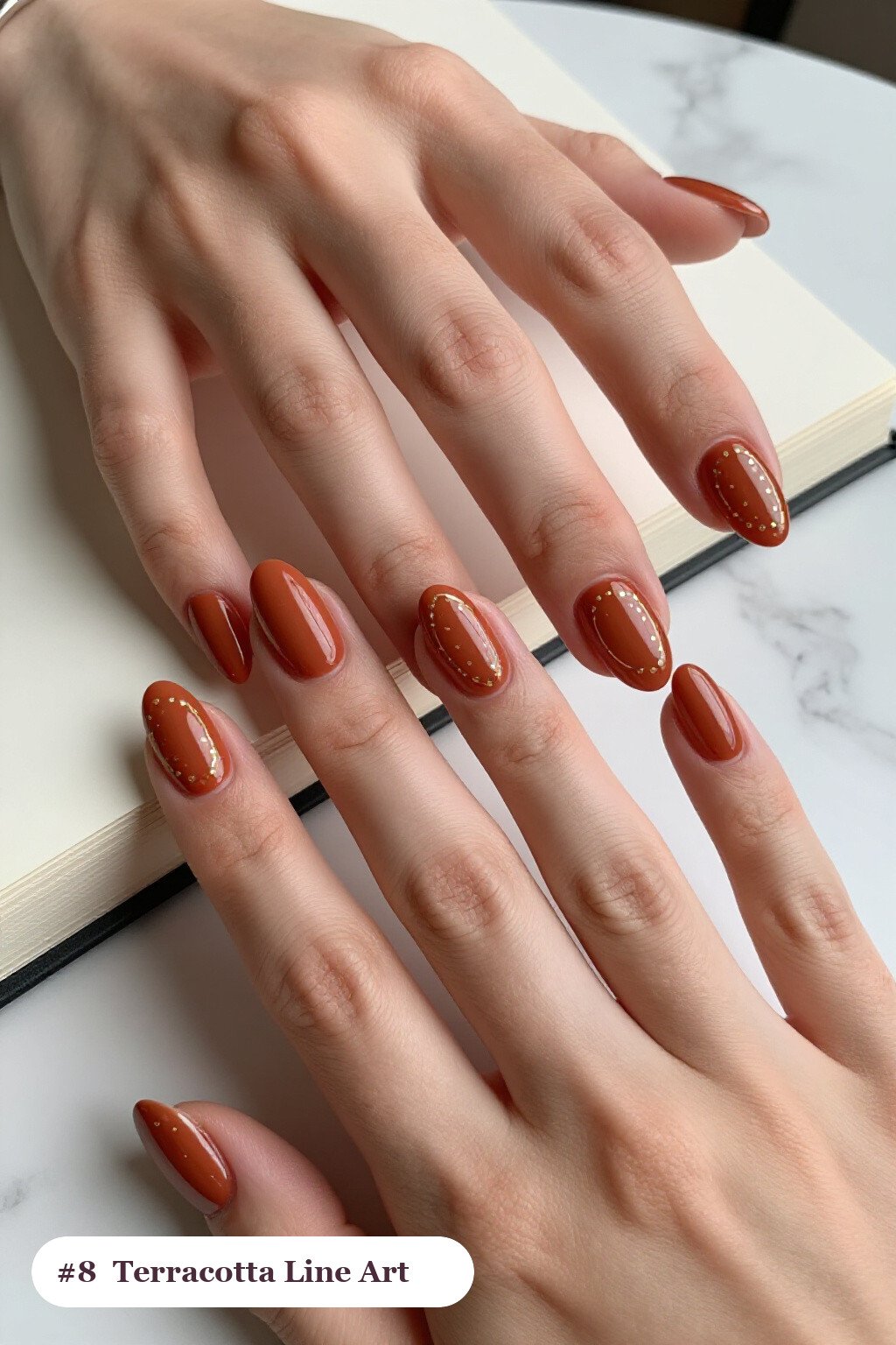 Short almond terracotta nails with fine gold line art and tiny dots drawn across every nail, thanksgiving style - simple short thanksgiving nail designs