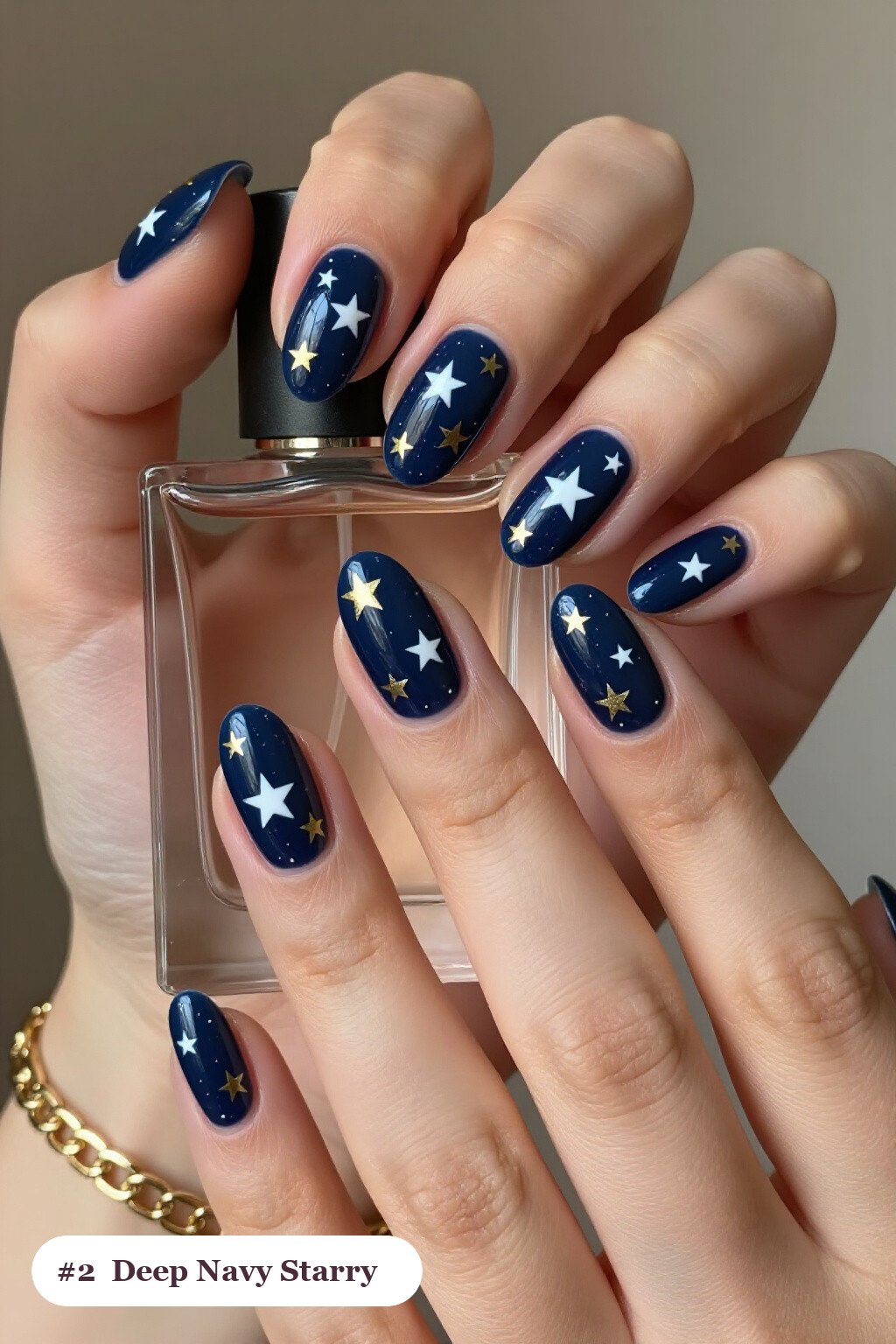 Deep Navy Almond Nails Sprinkled with White & Gold Stars for Cozy Winter - simple winter short nails Deep Navy Almond Nails Sprinkled with White & Gold Stars for Cozy Winter - simple winter short nails