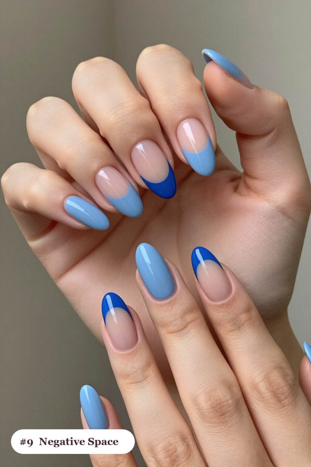 Icy Blue Almond Nails with Negative‑Space Nude Windows and Bold Colour Shapes - simple winter short nails Icy Blue Almond Nails with Negative‑Space Nude Windows and Bold Colour Shapes - simple winter short nails