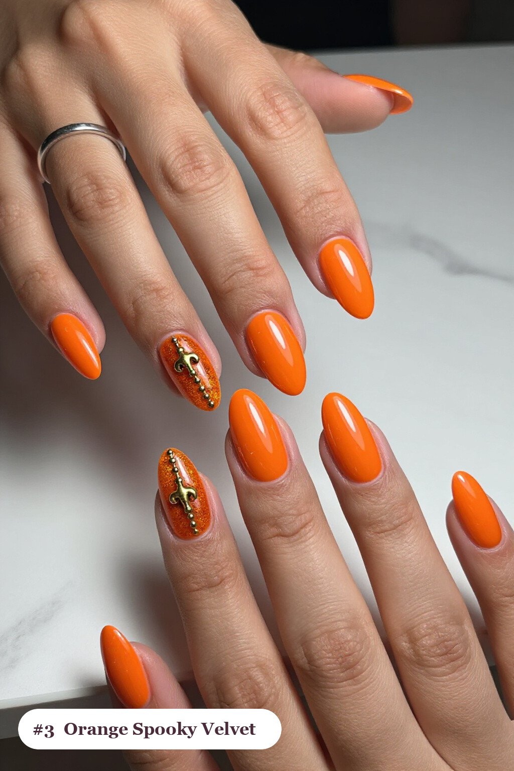 Orange Medium Almonds in Velvet Shimmer with Gold Charm Accent: Spooky Halloween Nails - spooky halloween nails