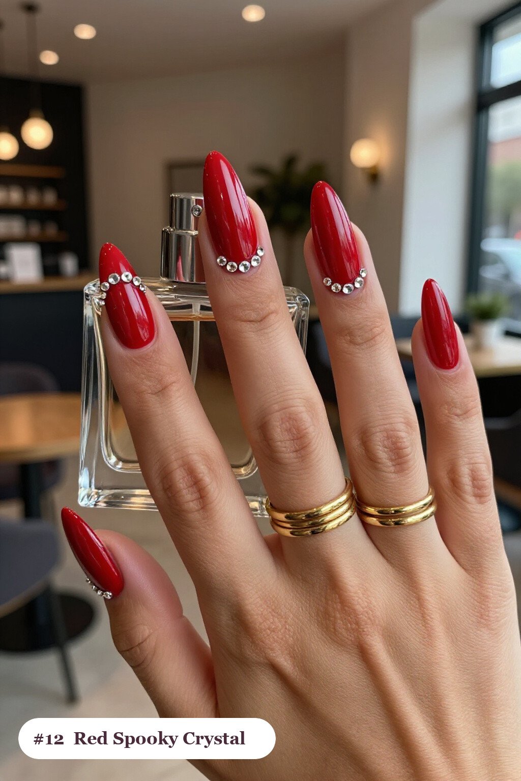 Medium almond blood red spooky nails with rows of sparkling crystal rhinestones along the cuticle of every nail, perfect for halloween - spooky halloween nails almond