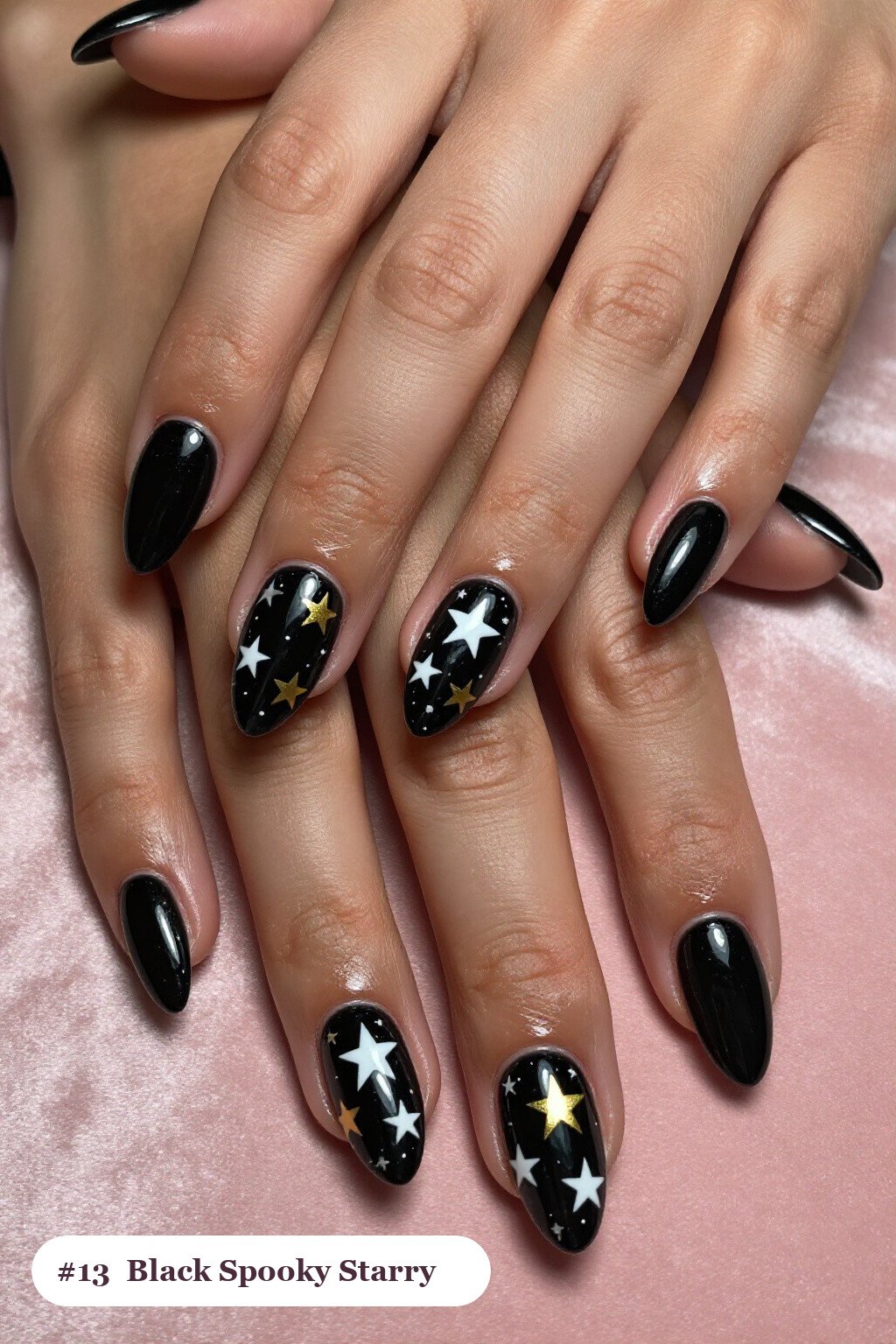 Medium almond black spooky nails with white and gold stars and sparkles painted on every nail, perfect for halloween - spooky halloween nails almond
