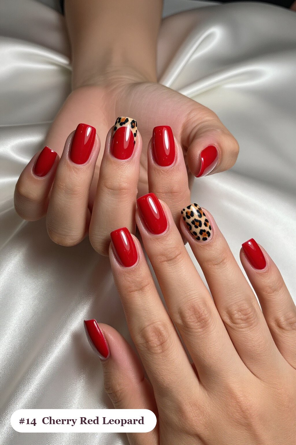 Medium square cherry red nails with a leopard print pattern on two accent nails and solid colour on the rest, thanksgiving style - thanksgiving acrylic nail ideas